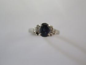 A platinum ring size P/Q - missing a small stone, worn to shank, otherwise good