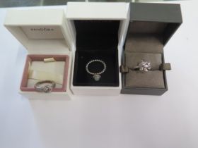 Two Pandora silver rings sizes K and L and a Clogau rolled gold ring size J - all generally good