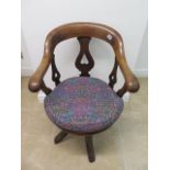 A Victorian mahogany swivel desk chair with inverted heart motifs - Height 88cm x Width 58cm with