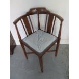 An Edwardian mahogany and inlaid corner chair