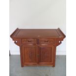 A 20th century Chinese carved alter type cabinet - Height 80cm x Width 93cm x Depth 40cm