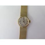 An Omega ladies 9ct yellow gold manual wind bracelet wristwatch with 16mm case - total weight approx