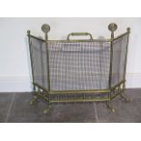 A brass fire guard - Height 63cm x Width 68cm - generally good, handle loose