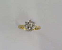 An 18ct yellow gold diamond cluster ring size J/K - approx weight 4 grams - good condition