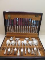 An Arthur Price eight setting canteen of plated flatware one fork has been replaced with a silver