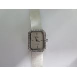 An 18ct white gold ladies Omega De Ville quartz watch with diamond bezel - new battery fitted