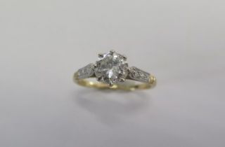 A yellow gold diamond solitaire ring - The central 1ct brilliant cut diamond approx 6.8mm x 3.