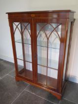 A modern yew wood veneer two door glazed display cabinet - Height 123cm x 91cm x 33cm