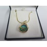 A 14ct Ammolite pendant on 14ct 44cm chain - total weight approx 16.9 grams - in good condition