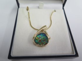 A 14ct Ammolite pendant on 14ct 44cm chain - total weight approx 16.9 grams - in good condition