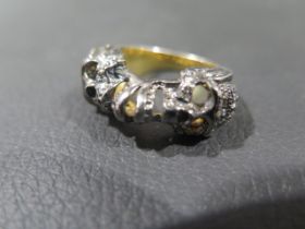 A diamond set double skull Memento Mori style ring in silver - rose cut diamonds approx 0.65ct -