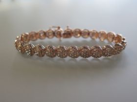 A certified 10ct rose gold round cut diamond cluster bracelet - diamonds 5ct - certificate number