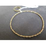 A 9ct yellow gold bangle - approx 6.5cm diameter - weight approx 5.3 grams - together with a 9ct