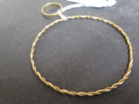 A 9ct yellow gold bangle - approx 6.5cm diameter - weight approx 5.3 grams - together with a 9ct