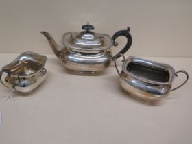 A three piece silver tea set - Teapot approx 26cm x 15cm, sugar bowl and milk jug Sheffield 1927 -