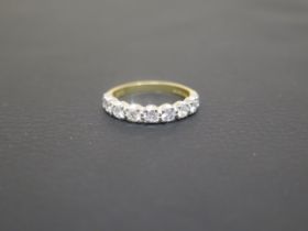 An 18ct yellow gold and diamond half eternity ring set with nine brilliant cut diamonds - ring