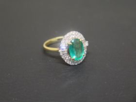 A good emerald and diamond cluster ring - The oval central emerald approx 2.2ct, surrounded by 38