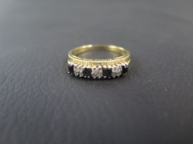 An 18ct yellow gold sapphire and diamond ring size S - weight approx 4.6 grams