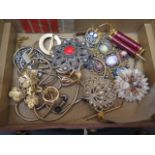 Costume jewellery in a brown leather jewellery box with key