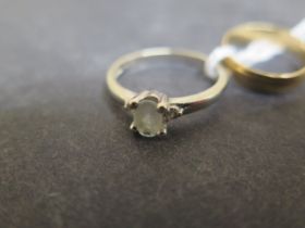 A 9ct white gold and aquamarine ring size N/O - weight approx 1.9 grams - together with a 9ct yellow