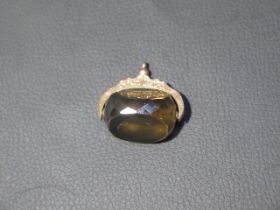 A good quality smokey quartz fob in a good qaulity mount stamped 9ct