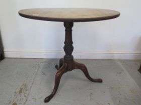 A 19th century mahogany tripod table with a 78cm diameter top