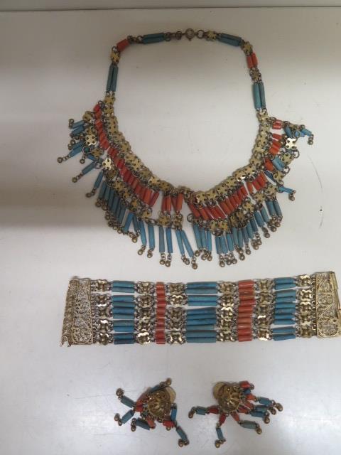 An Egyptian bracelet, necklace and earrings