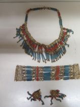 An Egyptian bracelet, necklace and earrings