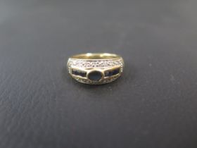 An 18ct gold sapphire and diamond ring size Q/R - weight approx 5.2 grams