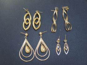 Four pairs of 9ct yellow gold earrings - weight approx 11.3 grams