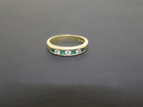 An 18ct yellow gold emerald and diamond ring size N/O - weight approx 4.3 grams