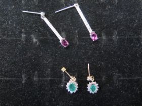Two pairs of 9ct gold earrings with ruby and emerald - weight approx 3.7 grams - 9ct white gold