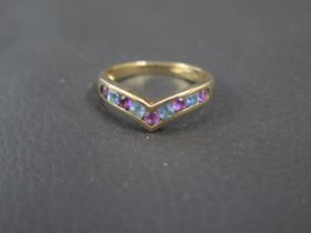 A 9ct yellow gold ring with amethysts - ring size P - weight approx 2.2 grams