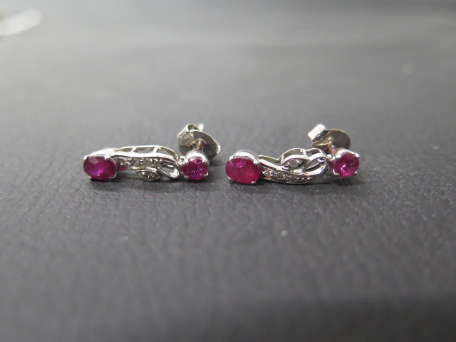 A pair of 18ct white gold and ruby drop earrings with diamonds - approx 2cm - weight approx 3.2
