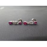 A pair of 18ct white gold and ruby drop earrings with diamonds - approx 2cm - weight approx 3.2