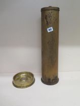 A large brass shell case dated 1918 - approx 50cm with lid, together with a brass shell case ashtray