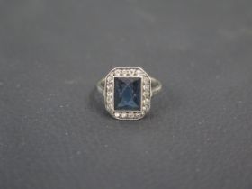 A 9ct yellow gold ring with blue stone - ring size M/N - weight approx 3.3 grams