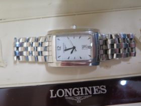 A gents Longines watch in its original box and in working order