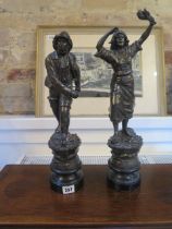 A pair of soft metal figures approx 43cm of a seafarer and lady