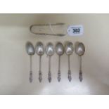 A set of six late Victorian scallop shell apostle teaspoons and sugar tongs Birmingham 1898/99