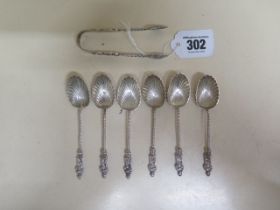 A set of six late Victorian scallop shell apostle teaspoons and sugar tongs Birmingham 1898/99