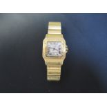 A Cartier 18ct yellow gold unisex Santos date quartz bracelet wristwatch no 887901 0878 - 29mm