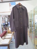 A British Military overcoat with brass button for Coldstream Guards together with a British Army