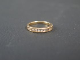 An 18ct rose gold and diamond child's half eternity ring size H/I - weight approx 2.4 grams