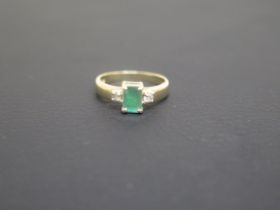 A 9ct yellow gold and emerald ring size K - weight approx 2.6 grams