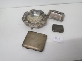 Two silver ashtrays, a silver cigarette case and a silver vesta case - weight approx 7.8 troy oz