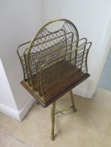 A 19th century brass revolving paper rack