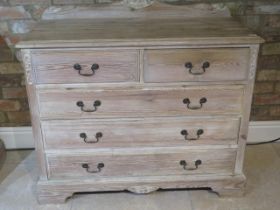 A pine chest with two short over three long drawers - Width 105cm x Height 83cm - in good condition