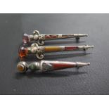 Three Scottish silver and hardstone Dirk brooches - the smallest hallmarked Birmingham 1912 - approx