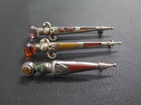 Three Scottish silver and hardstone Dirk brooches - the smallest hallmarked Birmingham 1912 - approx